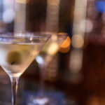 Close up shot of 2 martinis and olives