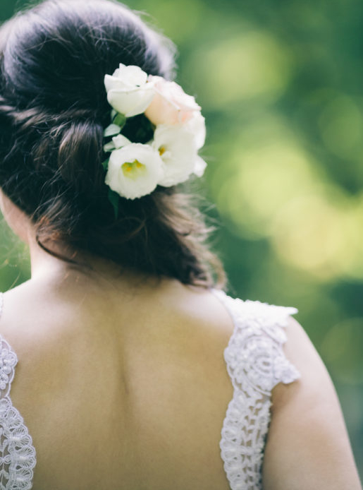 Back of a woman with beautiful hairstyle and white dress