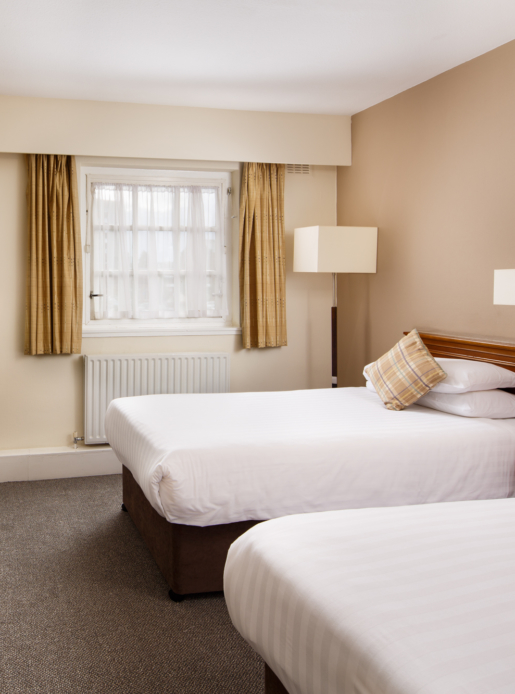 Classic twin bedroom at Mercure Perth Hotel, two single beds, desk, tv